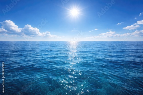 bright sunny day over calm deep blue ocean waters