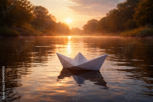 A serene paper boat floating gently on a calm river at sunrise