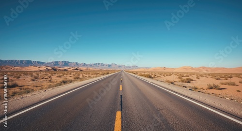 Spacious desert environment displaying a long road fit for travel themes with text overlay area