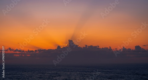 Vibrant sunset sky with sun...