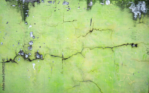 Cracked lime green concrete texture for background, latar belakang dinding beton hijau yang retak