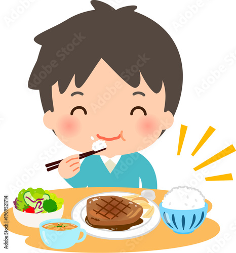 肉メインの洋食を食べる若い男性