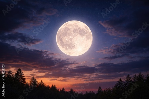 A bright full moon rising i...