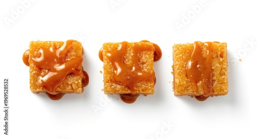 three caramel squares drizz...