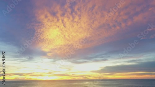 aerial view wave after wave swept towards the shore. 
Landscapes view of beach sea sand and wave in sunset. 
Beach sea space area. Blue sea, waves crashing at Karon Beach, Phuket Thailand.