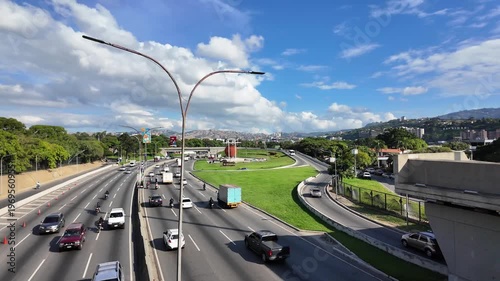 Pan left over the Autopista Francisco Fajardo towards Petare cityscape