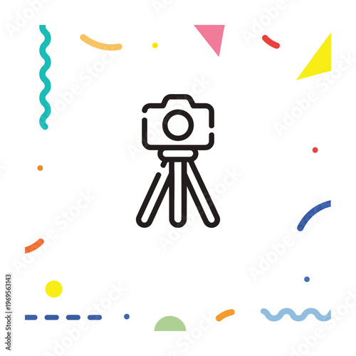 Camera mounted on a tripod surrounded by colorful shapes