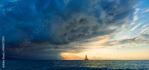 Sunset Inspirational Dramatic Approaching Storm Clouds Sailing Sailboat Ocean Hope Journey Adventure Banner Header