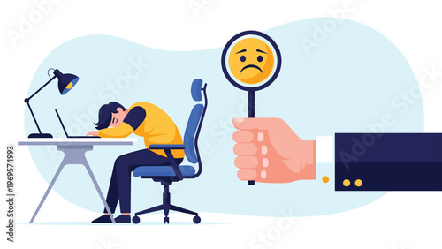 Large hand holding a magnifying glass with a sad face icon over a tired businessman sleeping at his desk for workplace burnout metaphor.