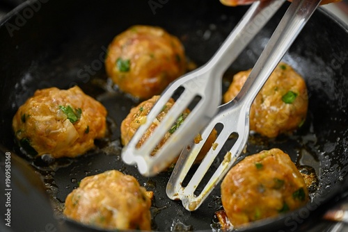 Moroccan Fish Patties Frying in Pan During Passover Holiday Traditional Homemade Cooking Process Close Up of Fish Balls in Oil
