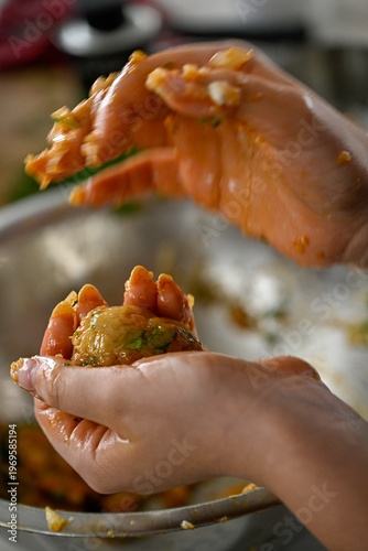 Hands Shaping Traditional Moroccan Fish Balls for Passover, Close Up of Homemade Fish Patties Preparation with Herbs and Spices in Kitchen, Authentic Holiday Cooking Process