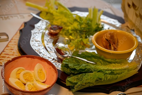 Traditional Passover Seder table set for Jewish holiday celebration in Israel, featuring festive dinner setup, symbolic foods, wine glasses, and family gathering atmosphere for Pesach evening.