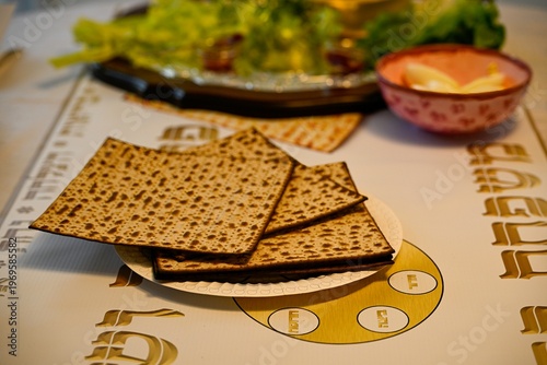 Traditional Passover Seder table set for Jewish holiday celebration in Israel, featuring festive dinner setup, symbolic foods, wine glasses, and family gathering atmosphere for Pesach evening.