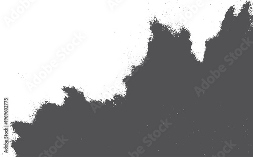 Dark grey ink splatter texture with rough jagged edges on a white background