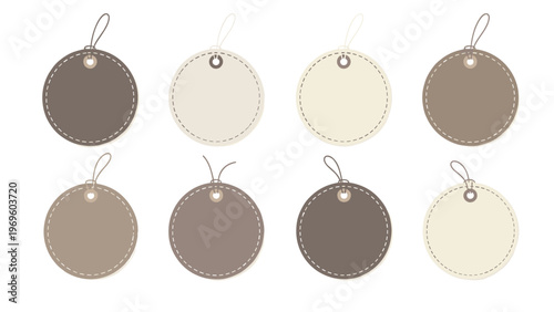 Set of eight round gift tags in various shades of brown and beige with string loops for retail price labels or holiday present cards design.