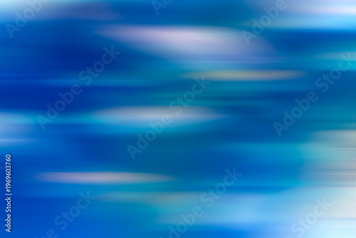 Blue abstract motion blurred background. Light pale blue surface 