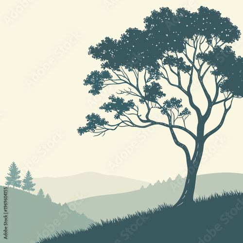 A tree on a hill overlooking rolling hills