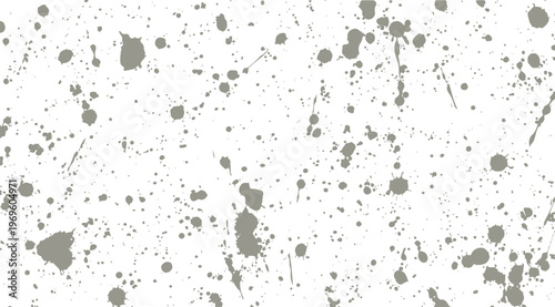 Grey paint splatter pattern on a white background with ink drops