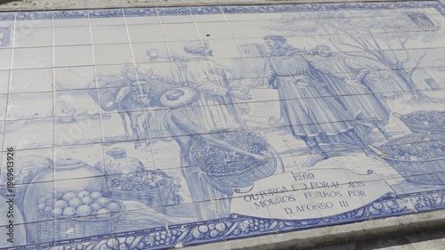 Decorative blue azulejos tile mural located near the entrance of Faro Old Town.