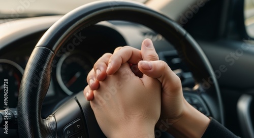 Hands on steering wheel driving.