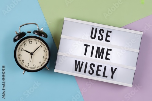 Use time wisely message on lightbox with retro alarm clock