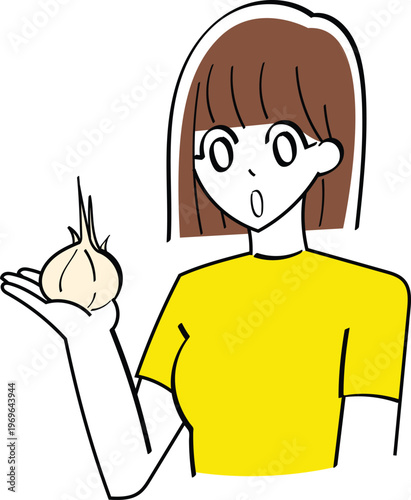 Surprised woman holding a garlic bulb