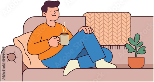 A man sitting on a couch with a mug and a plant nearby.