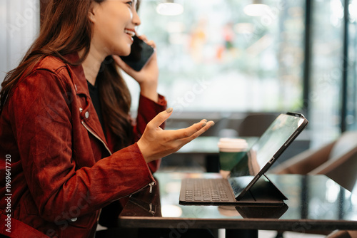 Businesswoman hand working digital marketing media in virtual screen with mobile phone and modern compute