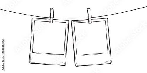 Two blank polaroid frames hang on a line creating a simple minimalist aesthetic silhouette high quality