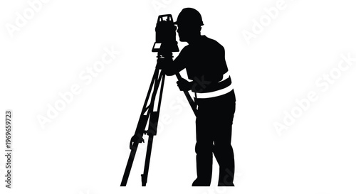 Surveyor using a theodolite and tripod a striking black silhouette