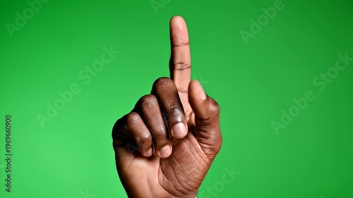 Wallpaper Mural African American hand pointing one finger up green background Torontodigital.ca