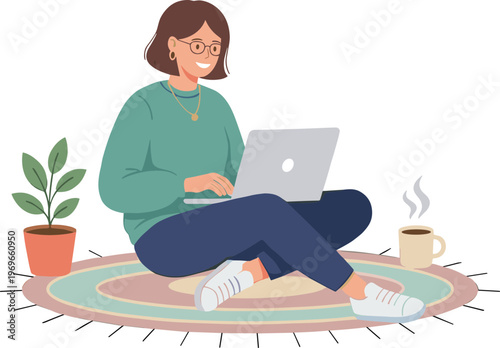 Woman sits on colorful rug working on laptop with coffee and plant nearby indoors