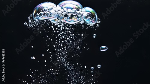 Wallpaper Mural Two vibrant iridescent water bubbles burst on dark background Torontodigital.ca