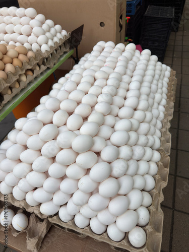 Fresh white brown eggs cardboard trays market stall Easter preparation holiday sale