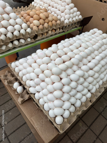 Fresh white brown eggs cardboard trays market stall Easter preparation holiday sale