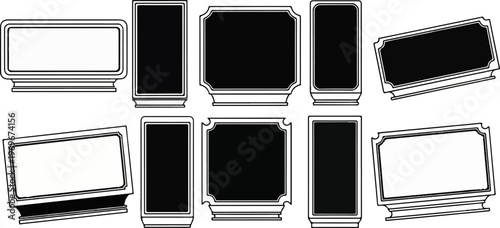 Various black and white frames or plaques, some tilted, some upright