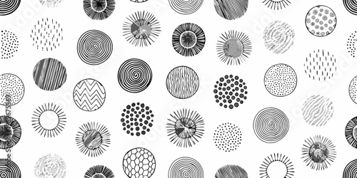 Abstract pattern of hand drawn circles and swirling lines in black and white
