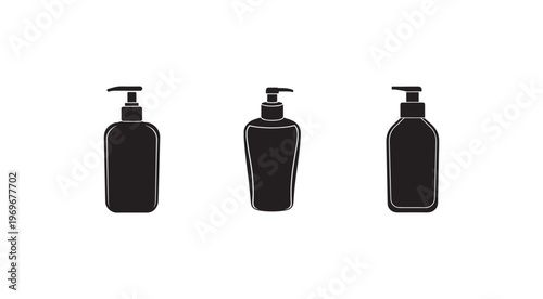 Three black bottles with pump dispensers for cosmetics or soap  isolated on white background