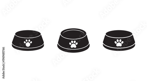 Three black dog food bowls with white paw prints on a white background  pet feeding dishes  animal nutrition  canine meal bowls