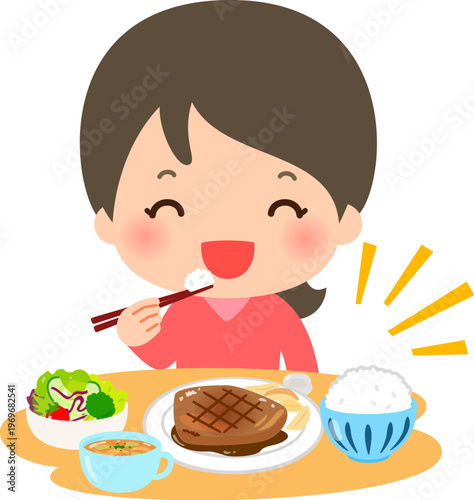 肉がメインの洋食を食べる若い女性