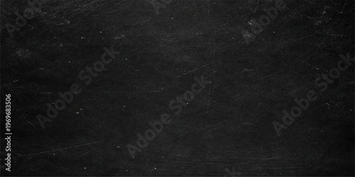 Abstract a textured black chalkboard, displaying a unique vintage aesthetic with subtle imperfections and light scratches. It is ideal as a design element for presenting information.