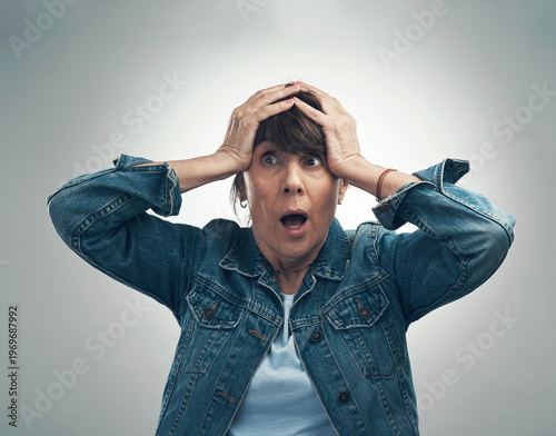 Картината върху платно Studio, stress and mature woman with shock for accident scene, disbelief or overwhelmed by crisis