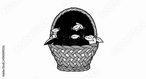 Woven basket overflowing with dark contents and scattered leaves