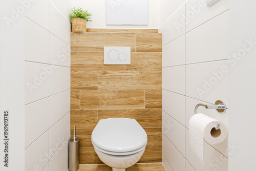 Bild auf Leinwand White toilet in a modern minimalist bathroom with wooden wall tiles