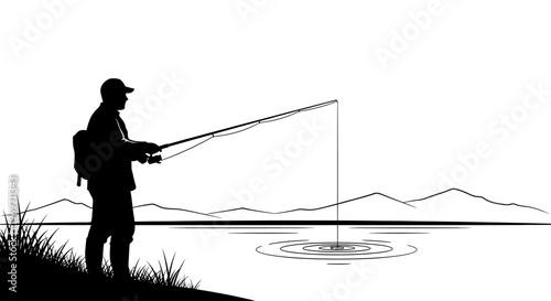 Silhouette of a man fishing on the bank of a lake with mountains in the background under a clear sky.