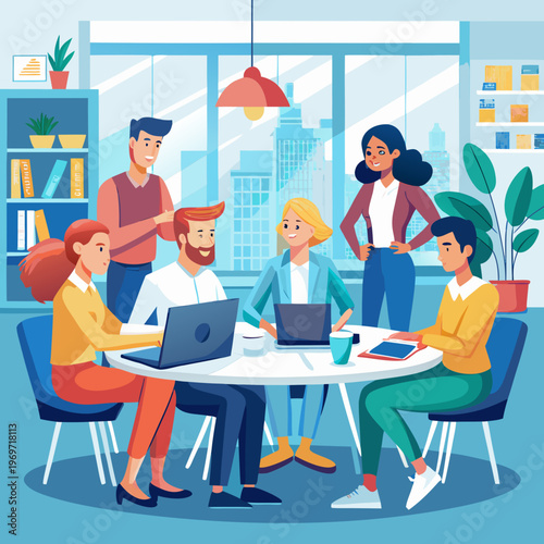 A group of people sitting around a table with laptops in an office setting