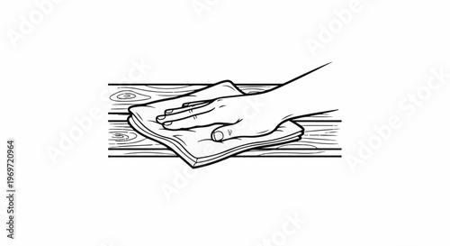 Hand wiping wooden surface with cloth