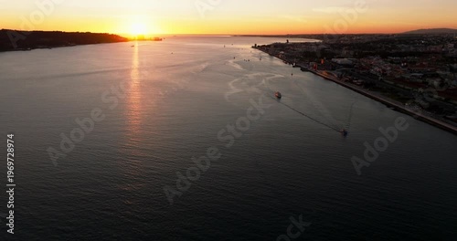 Evening sunset light on Lisbon Portugal 25th April red suspension bridge famous iconic landmark skyline