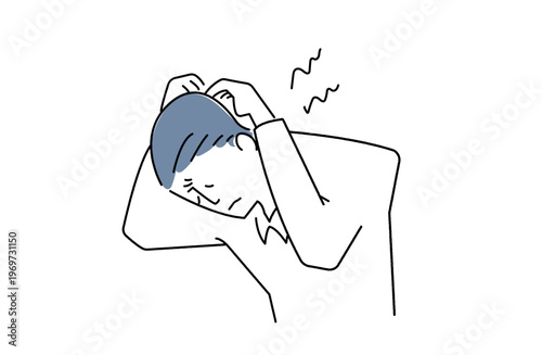 頭を抱えて眉間に皺を寄せる男性