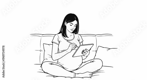 Pregnant woman with tablet on couch